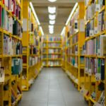 a long row of yellow shelves filled with books